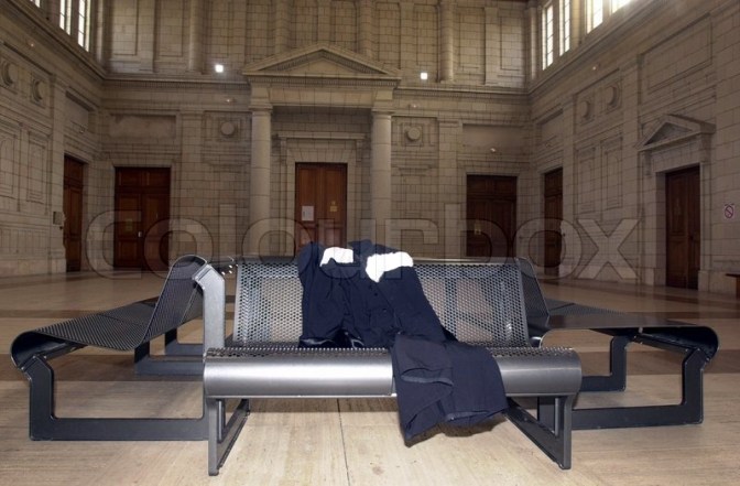 559179-strike-of-lawyer-with-robe-on-bench-in-courtroom